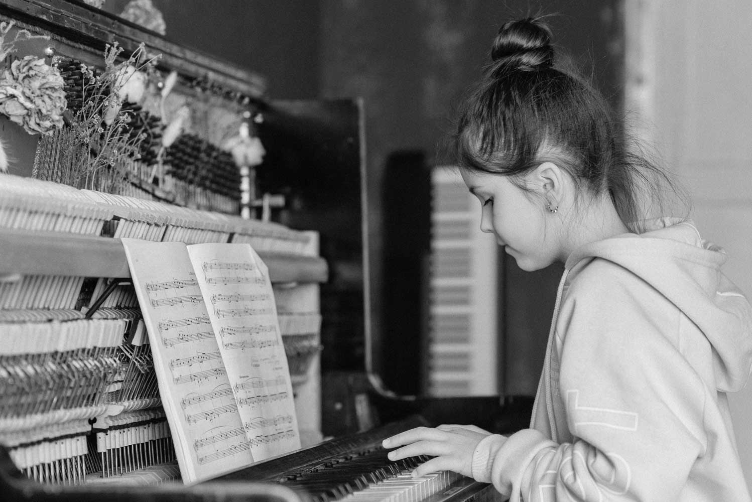 child playing piano - Muhlenberg Music Mission